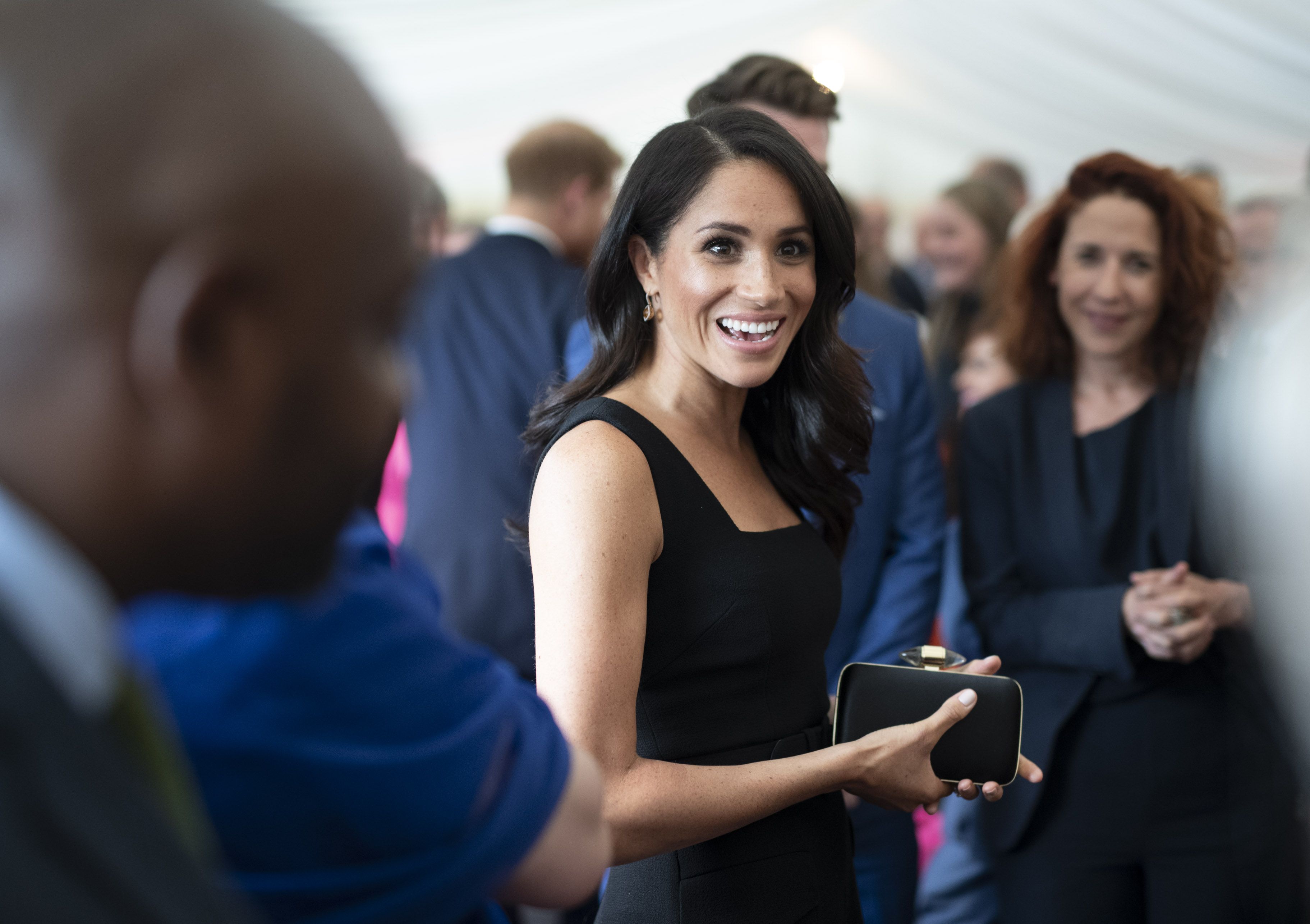 Znalezione obrazy dla zapytania meghan duchess of sussex black dress