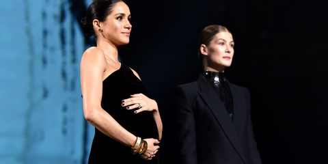 There's a reason Meghan Markle keeps cradling her baby bump