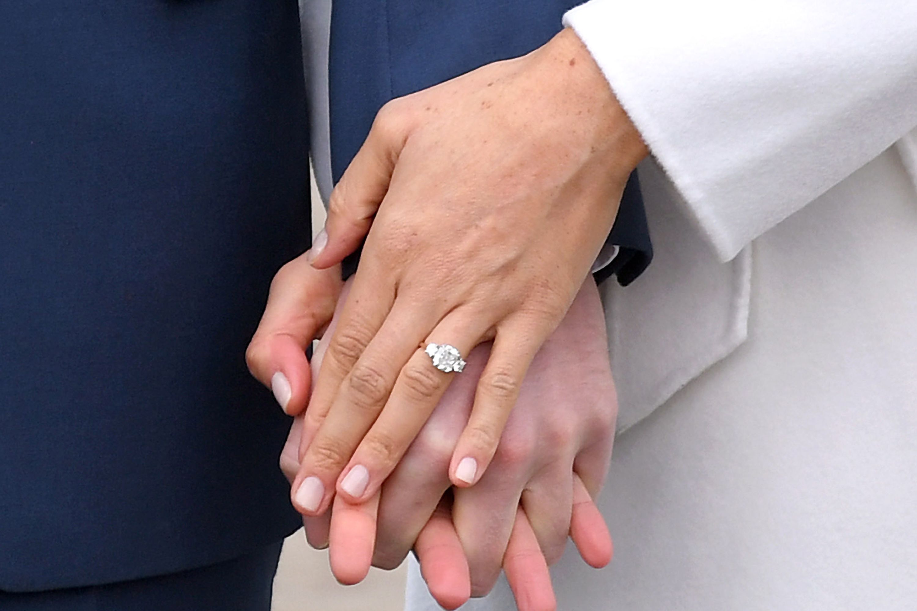 engagement ring holding hands