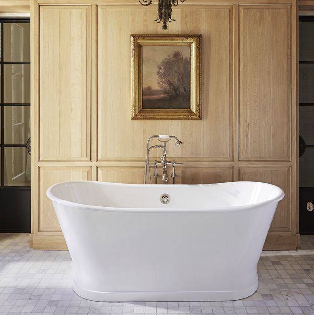 handsome oak paneling and a deep soaking tub headline the owners bath