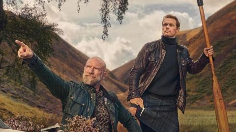 sam heughan and graham mctavish pose in a canoe for the men in kilts poster