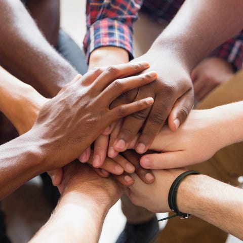 suicide prevention - Men joining hands in group therapy suicide prevention - Men joining hands in group therapy