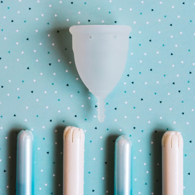 menstrual cup on blue background