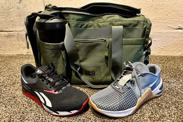 two sneakers on a carpet in front of a gym bag