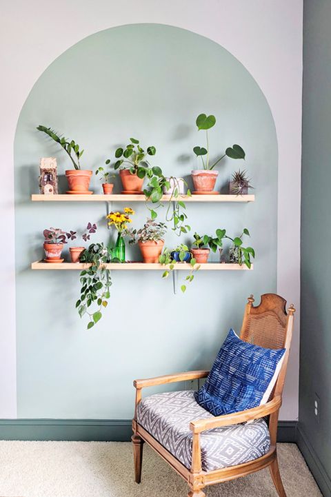upcycling idea painted arch with open wood shelves full of plants