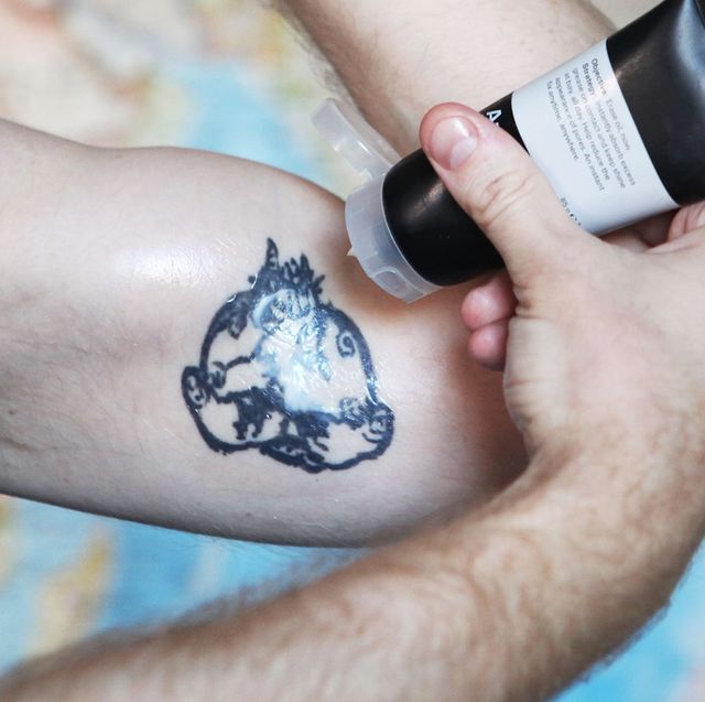 tatoo cream on male bicep tattoo