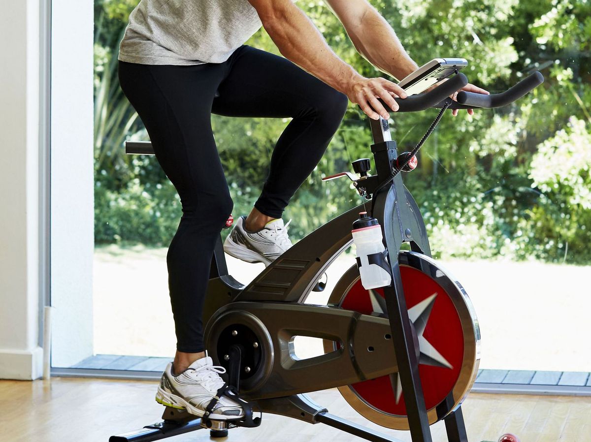 10 Best Exercise Bikes to Spin In Your Home Gym 2020 - Mh Man Working Out On Exercise Bike At Home Royalty Free Image 596568573 1536603103.jpg?crop=0.853xw:0.639xh;0.0785xw,0