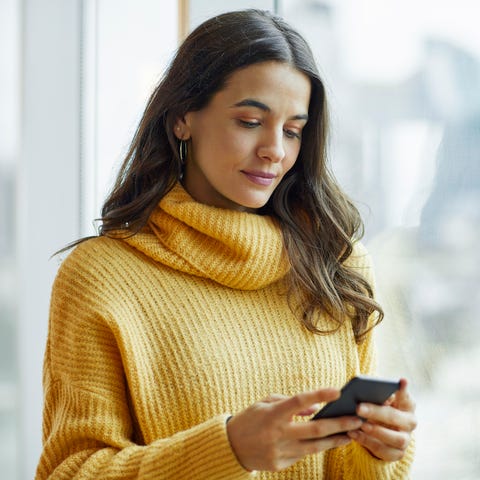 mid adult executive using smart phone at office