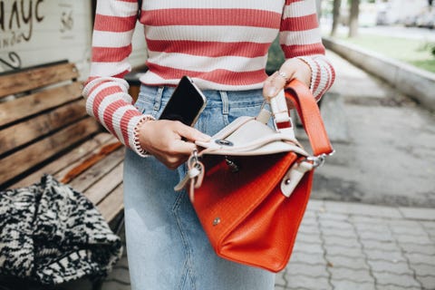 Midsection Of Woman Holding Bag