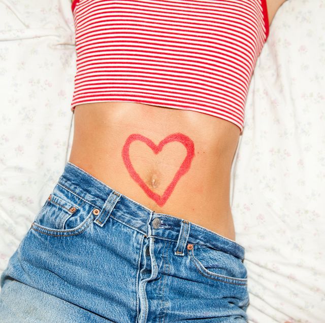 midsection of woman with heart drawing on stomach