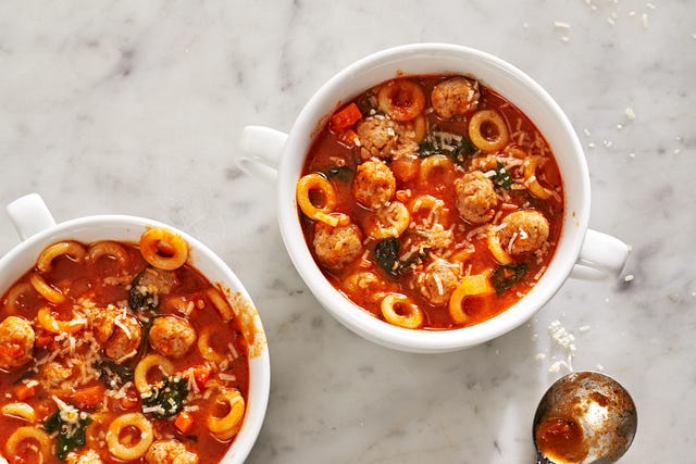 Mini Meatball & Pasta Marinara Soup - Delish.com mini meatballs and anelletti ring shaped pasta sit inside two bowls of marinara soup