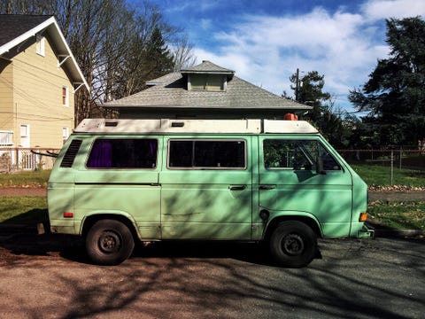 Mini Van Parked On Street Against Building