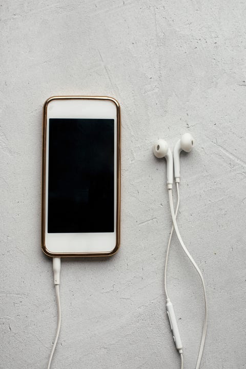 Mobile Phone and headphones on white background