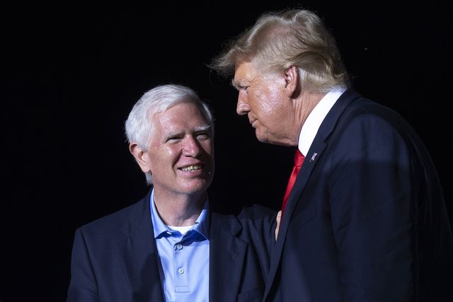 cullman, alabama   august 21 former us president donald trump r welcomes candidate for us senate and us rep mo brooks r al to the stage during a 