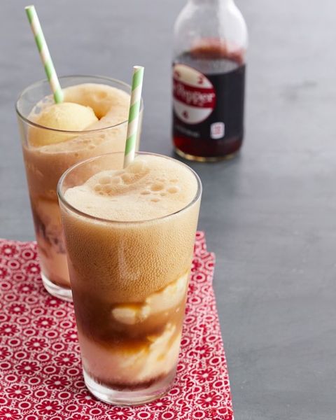 dr pepper floats with green straws soda bottle in back