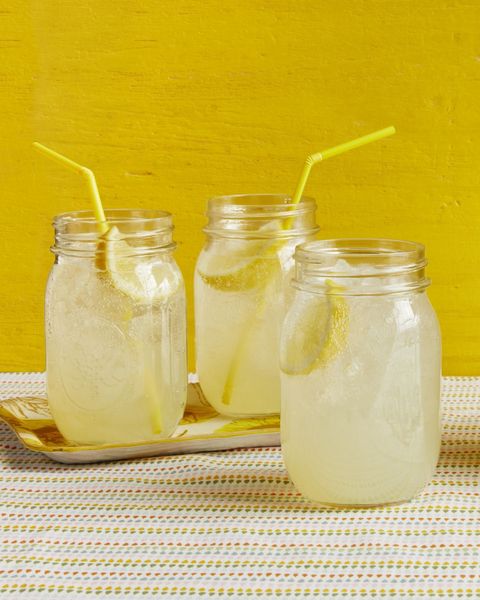 sparkling ginger lemonade in jars yellow background