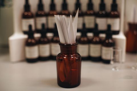 mockup brown glass bottle with blotter paper for testing smell of essential oil and fragrance