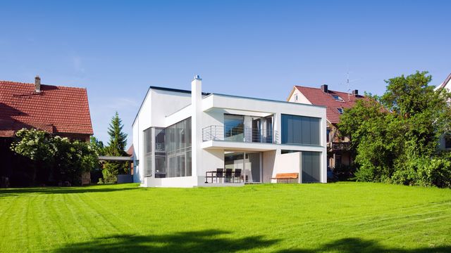 modern architecture home green on green summer meadow