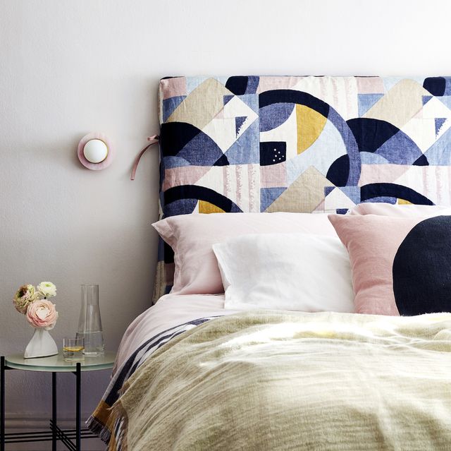 clutter free bedroom with modern geometric headboard in bedroom