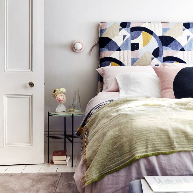 clutter free bedroom with modern geometric headboard in bedroom