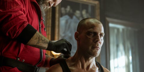 Money Heist: Part 4 – José Manuel Poga as Gandia Money Heist: Part 4 still of José Manuel Poga as Gandia getting stitches at the base of his neck