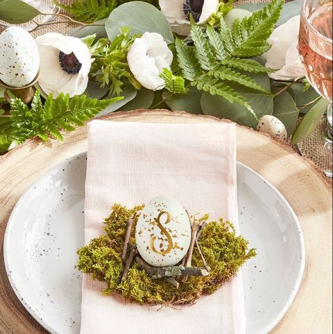 a place setting that uses an egg as a placecard