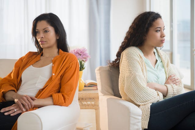 mother and daughter arguing in living room