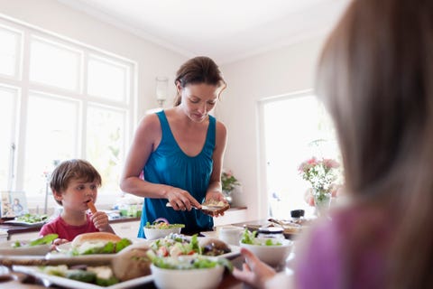 mother preparing food for kids