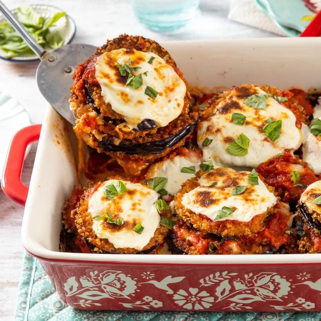 eggplant parmesan in red casserole dish