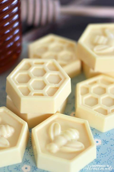 milk and honey soaps molded in hexagon shapes with honeycomb and bee designs that you can make for a diy mothers day gift