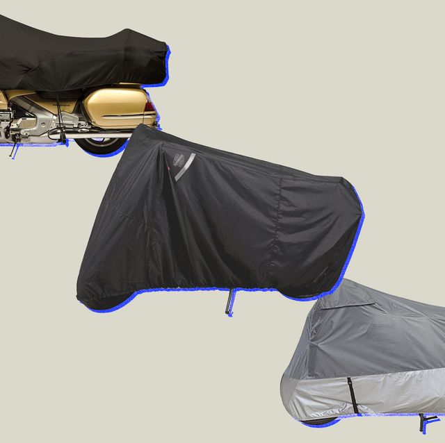 three motorcycles with covers on