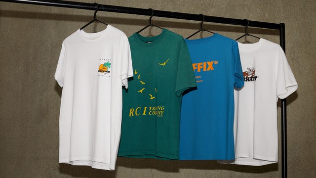 graphic tee shirts hanging on clothing rack