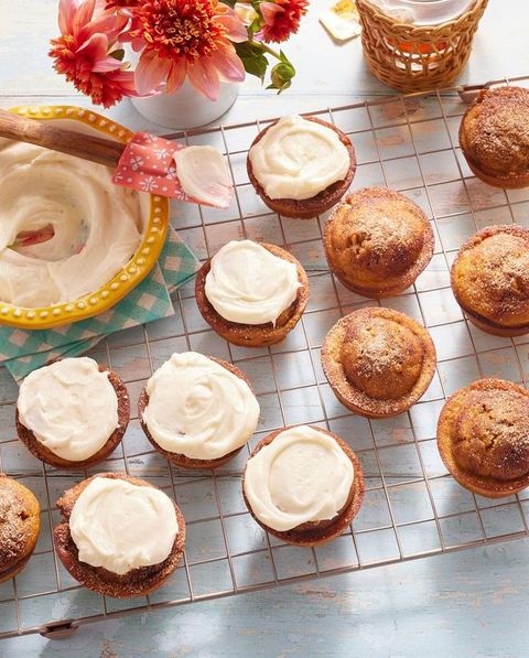 pumpkin spice muffins wire rack with cream cheese frosting