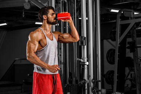 Muscular Men Drink His Nutritional Supplement