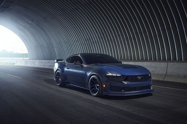 ford mustang dark horse driving through a tunnel