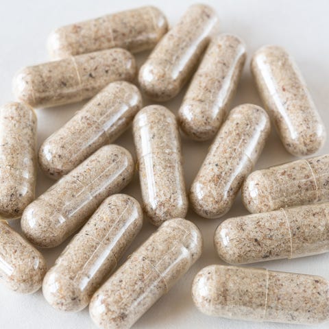 Natural fibre capsules over a white background natural fibre capsules over a white background