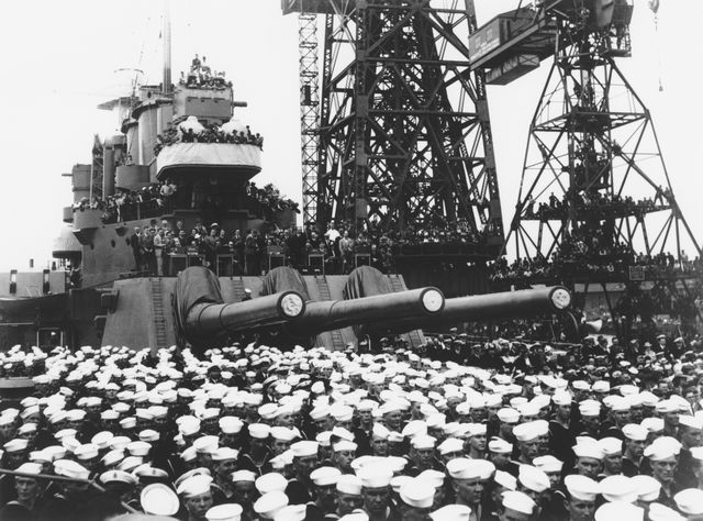 sailors gather around one of the stern 16"45 caliber mark 6 gun turrets of the north carolina class battleship of the united states navy the uss washington bb 56 whilst being commissioned for duty at the philadelphia naval shipyard on 15 may 1941 at philadelphia, united states  photo by keystonegetty images