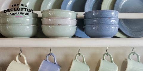 Crockery shelves with blue and green plates and cups