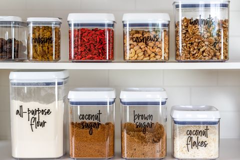 neatly organized transparent canisters for baking ingredients