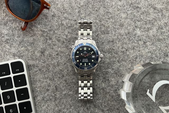 omega seamaster dive watch on desk