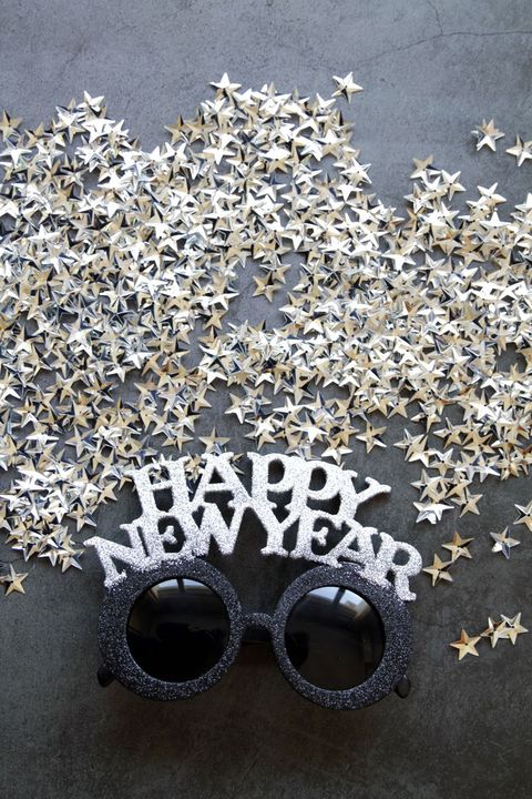 new years glasses and silver stars