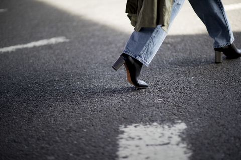 White, Pedestrian, Asphalt, Standing, Human leg, Leg, Footwear, Road surface, Walking, Shoe, 