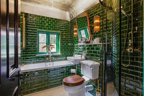 dark green metro tile bathroom