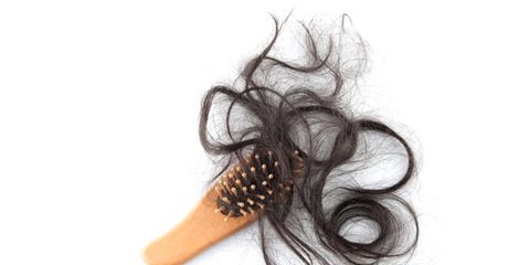 hair loss treatment; brush with hair strands