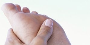 facts about gout-woman massaging foot