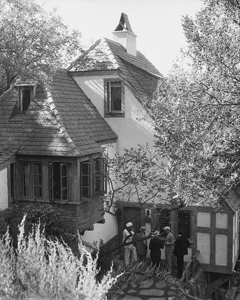 Newspapermen Gathering Outside House