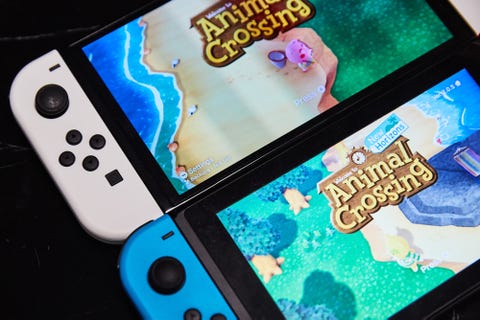 nintendo switch oled and nintendo switch with animal crossing on display