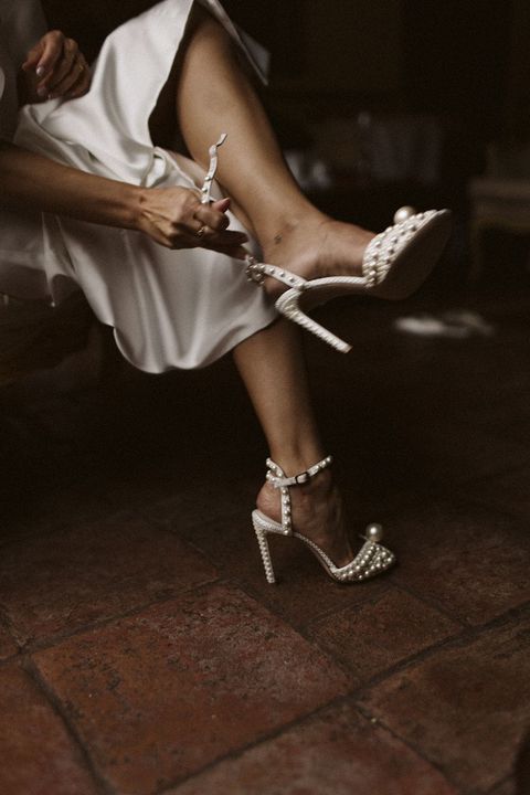 The Spanish bride with a cherubin dress and pearl sandals