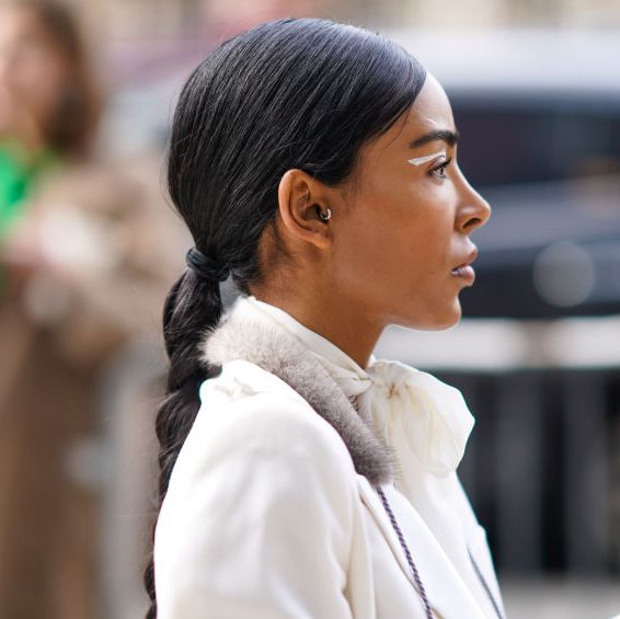 new york, new york   february 09 a guest wears a white coat, small earrings, outside bevza, during new york fashion week fall winter 2020, on february 09, 2020 in new york city photo by edward berthelotgetty images