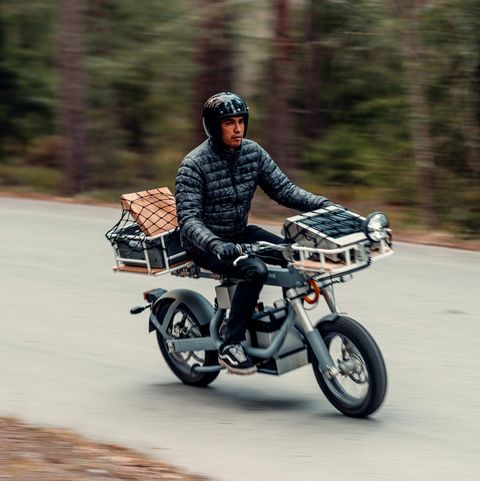 a man riding the osa plus motorcycle